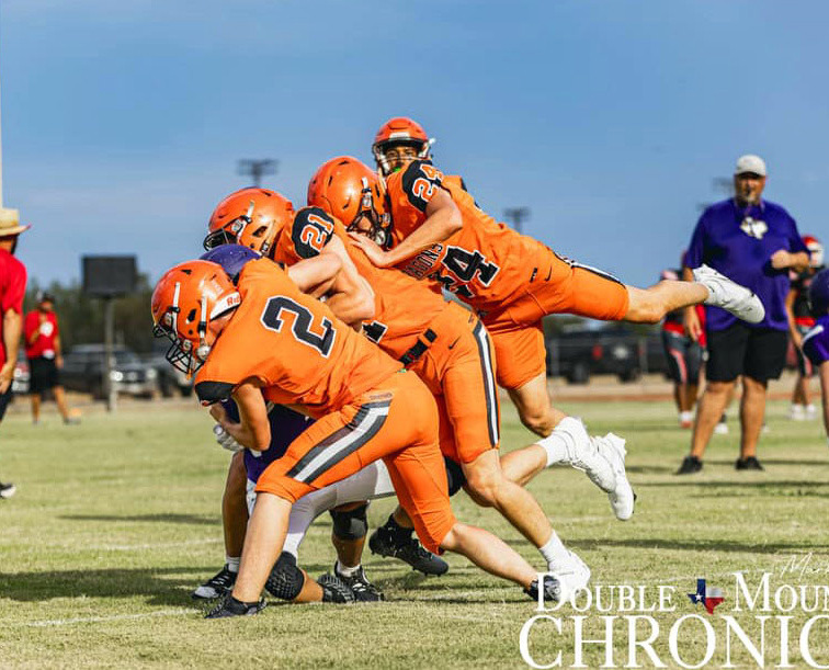 The Paducah Dragons traveled to Aspermont last week for their final scrimmage of the year before regular season play gets underway. Shown here are the Dragons doing battle with theThrockmorton Greyhounds. | DOUBLE MOUNTAIN CHRONICLE PHOTO
