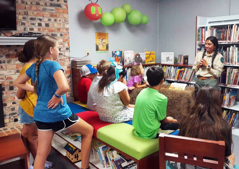 CAPROCKLIBRARYSUMMERREADING JulietteGarzafromCaprock Canyons State Park did a presentation last week at the Caprock Library in Quitaque, teaching youngsters about the bison at park. She read a story to the kids about where, how and why CCSP now has the bison, and brought a bison picture for the kids. Next up, the library will have Texas A&amp;M Forest Service staff for a presentation Wednesday, July 24 at 2 p.m. | COURTESY PHOTO