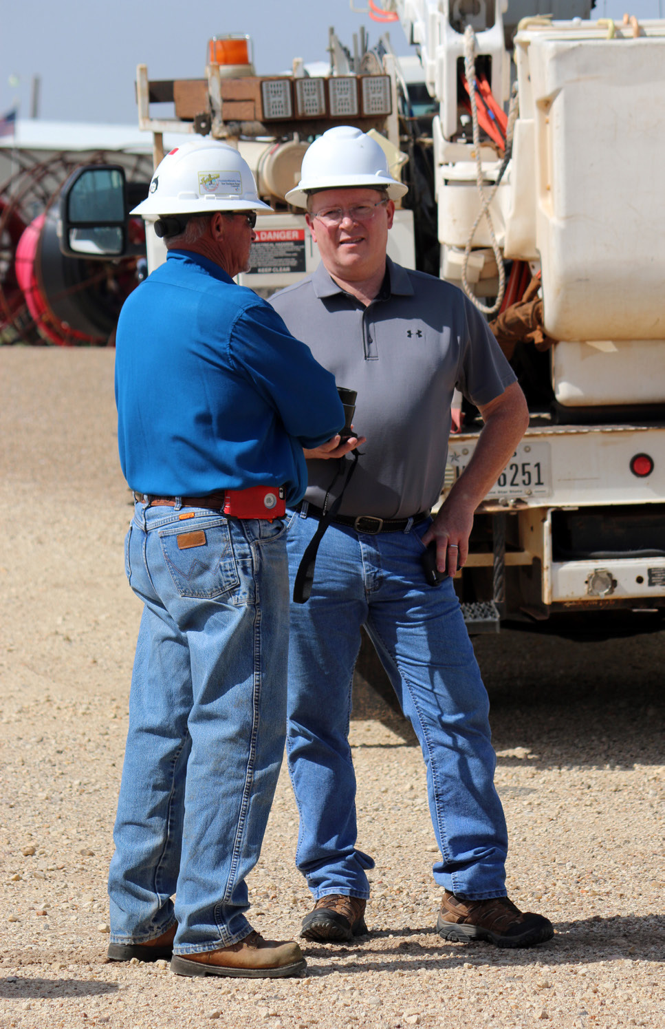 LINEMANTRAINING Mike Green (right) worked in the field—here, withDickieCloyd—beforemovingintotheoffice. | COURTESYPHOTO