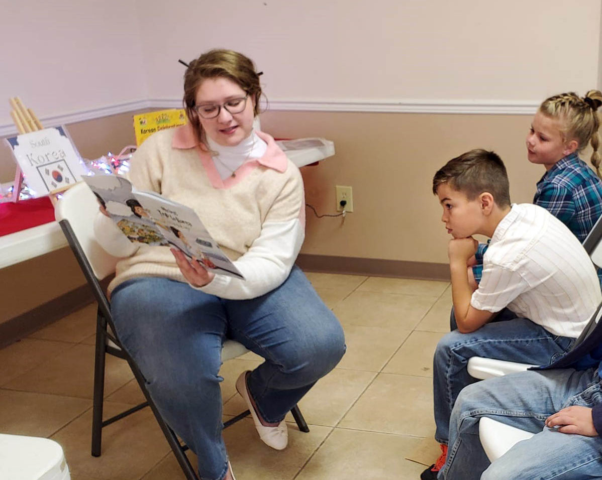 CHRISTMAS AROUND THE WORLD Volunteers at the Caprock Public Library in Quitaque last week continued a special tradition, “Christmas Around the World,” with area schoolchildren. | COURTESY PHOTOS