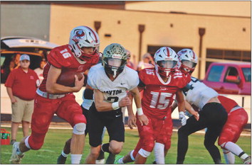 SILVERTON SHUT OUT The swarming Jayton defense shut down much of the rushing game of the Silverton Owls inThursday night’s 46-0 shut-out by the Jaybirds. Senior Sawyer Francis, #16, attempts to get some offense going. | AMANDA MCGEE PHOTO