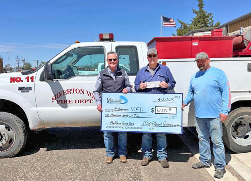FIRE FUNDS Mid-PlainsCommunicationsrecentlymadedonations to six area fire departments. From left are Dusty George, Mid-Plains CEO/General Manager; Silverton Fire Chief JoDee Robinson; and Jared Francis. | COURTESY PHOTO