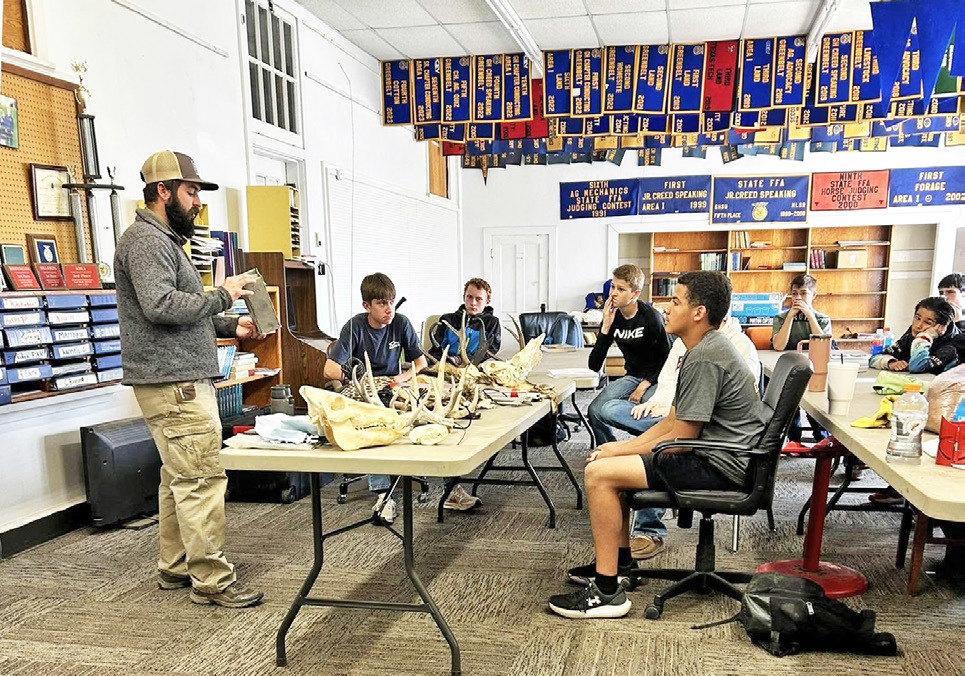 Hunter Hopkins with MatadorWildlife Management Area (Texas Parks and Wildlife) visited with the Motley County FFA Wildlife team 8th graders and discussed the different tools and techniques staff use out at the MWMA. | COURTESY PHOTO