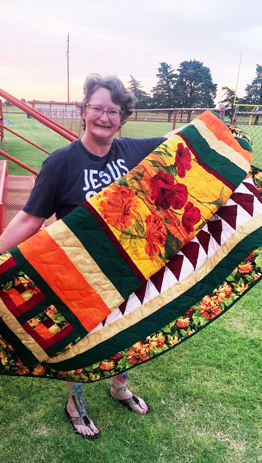 CongratulationsgotoAnnCramer-Flemingon winning the Paducah Pool Project quilt raffle at the community’s Fourth of July celebration. Ann is the daughter of former Paducah mayor Rodger Brannen. | COURTESY PHOTO