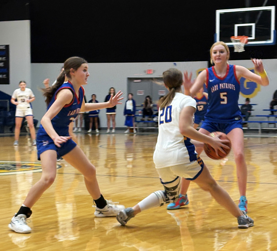 DOUBLE-TEAM Valley’s Cruse Paisley (left) and Allie Pigg (5) trap a Spur player in the Lady Patriots’ district win January 17. | SUE JANE SULLIVAN