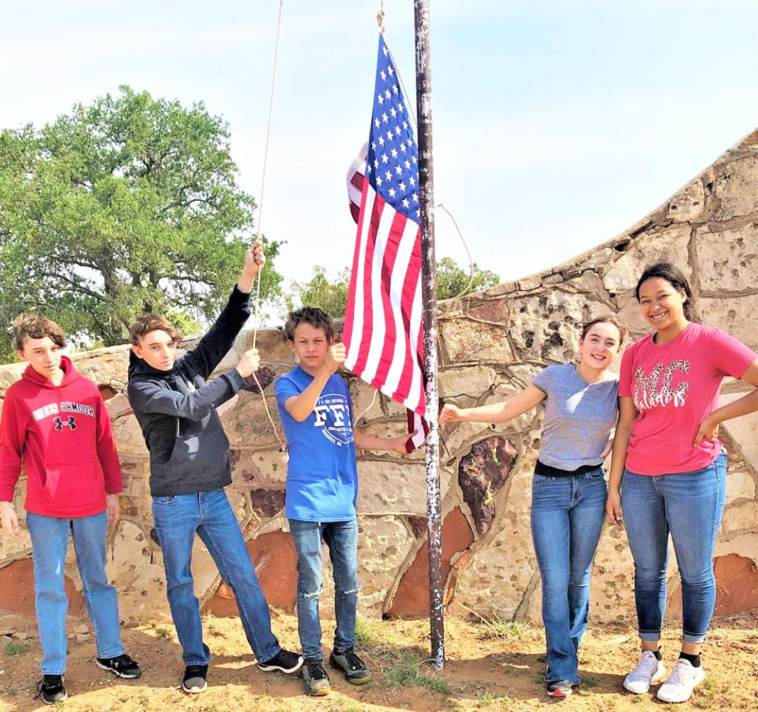 MOTLEY MEMORIAL FFA members Trent Barclay, Trevor Barclay, Matthew Hutchinson, Bailea Lawrence and Jada Richards helped honor those who served on Memorial Day by replacing service crosses and placing flags to recognize veterans. | JIM COOPER PHOTO