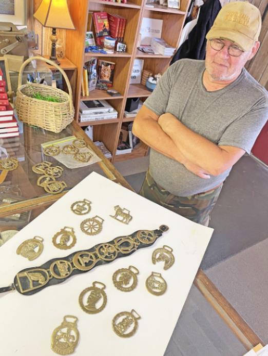 TOP BRASS Jon Shipp, a native of England but now a resident of Spur, explained about horse brasses, including the one celebrating the Silver Jubilee of Queen Elizabeth II. | THE TEXAS SPUR