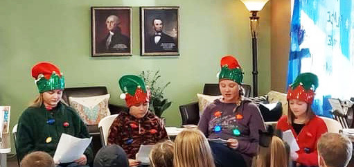 CHRISTMAS AT THE COURTHOUSE Silverton 6th graders read “’Twas the Night Before Christmas” at the library during the courthouse square holiday lighting. | COURTESY PHOTO