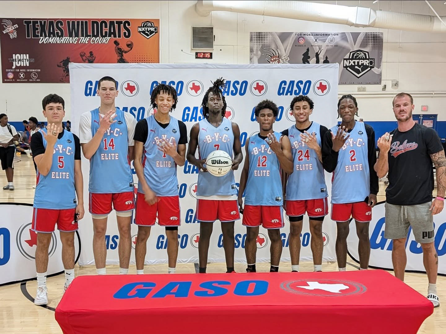 (second from left) alongside his BYC EliteTeam to go 6-0 as the Champions in the GASOSummerChampionshipattheiconicDuncanvilleFieldhouse in Duncanville, Texas. | COURTESY PHOTO