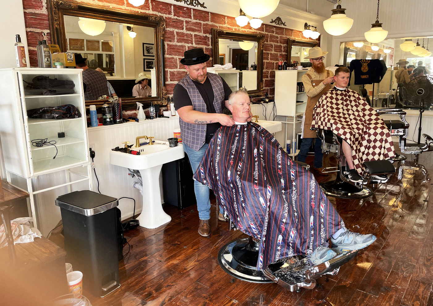 HAIRCUTS AT HAM’S Ham’s Barbershop in downtown Turkey was recognized with a historical marker last week during Bob Wills Day festivities.To celebrate the occasion, haircuts were given in the historic barbershop on Saturday. Renowned musician Bob Wills himself once cut hair at the shop. Preservationist Mike Goolsby, who also recently restored the Phillips 66 gas station inTurkey, undertook the historic restoration project. MORE HIGHLIGHTS ON THE 52nd BOB WILLS DAY, PAGE 10 | CAPROCK COURIER