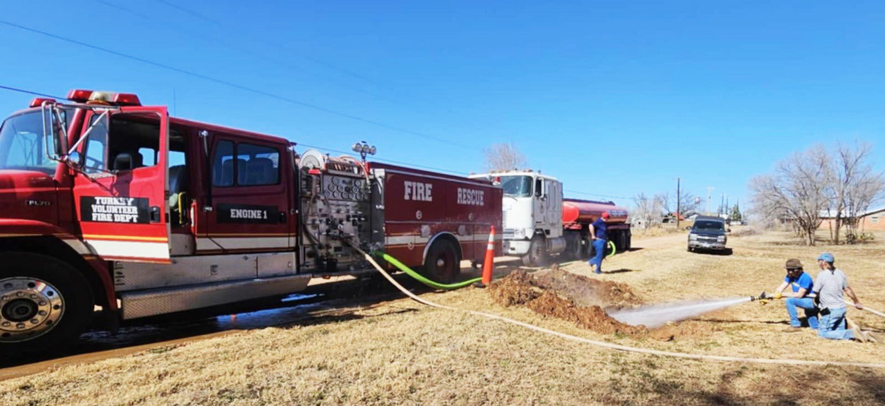 TURKEY VFD ASSISTED CITY employees with infrastructure improvements, used the fire engine to wash out a silted culvert last Thursday. | COURTESY PHOTO