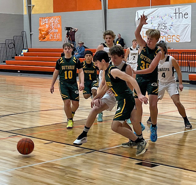 Jaguars Scrappy Trevino (10), Steven Uribe (1), Zane Moore (21) and Clay Hodges (30) teamed up on defense against the Woodson Cowboys at the Rotan Tournament last weekend. | CAPROCK COURIER