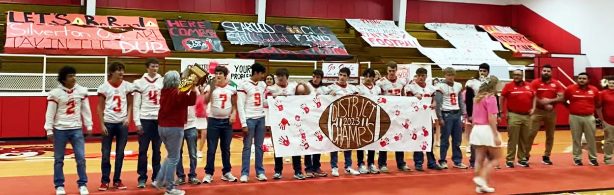 DISTRICT CHAMPS Last week at a pep rally, Silverton ISD superintendent Michelle Francis congratulated the Owls football team and coaches on winning district. | COURTESY PHOTO