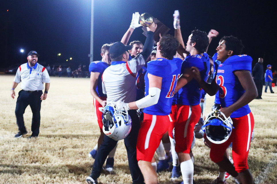 GOLD BALL CHASIN’ Valley’s homegrown head coach Dax Allen carries his first gold ball as a head football coach to his team following their bi-district blowout against the Northside Indians last Friday night. | VALLEY YEARBOOK