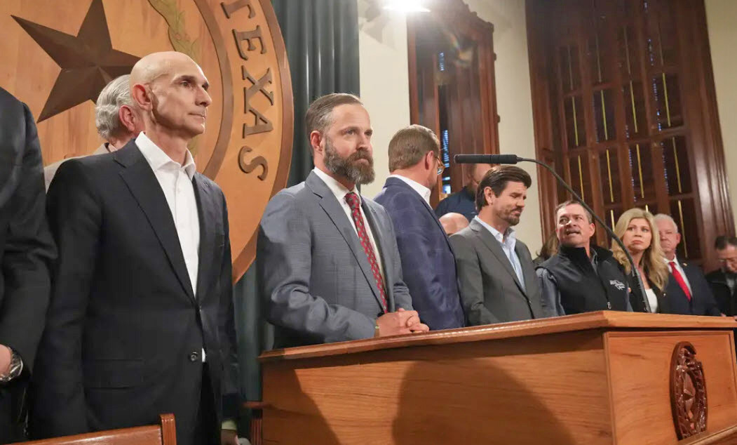 REP. DUSTIN BURROWS (R-Lubbock), center, at lectern, made a power play last weekend for leadership of the Texas House of Representatives; matters were still very much up in the air at newspaper press times. | TEXAS TRIBUNE
