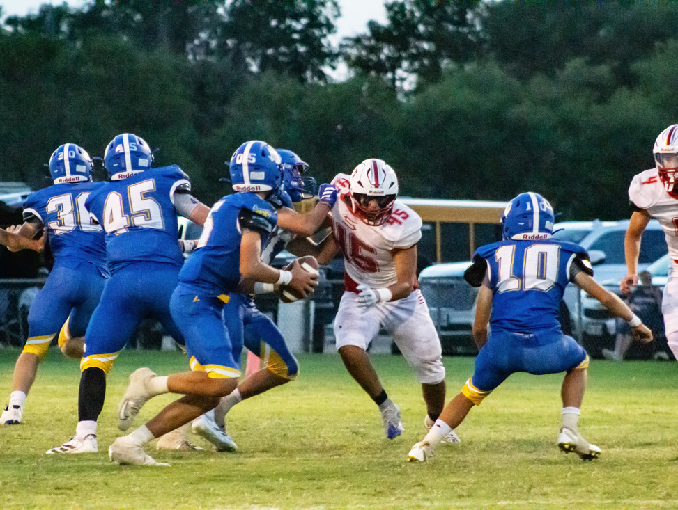 ONAQBHUNT Owl Cain Narvaez finds a hole in the Swift defense, hunting for a sack on the quarterback during Friday night’s game against Nazareth. | KODIE FAIRCHILD