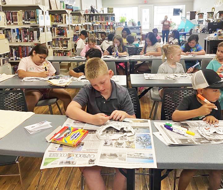 CaprockCountrylibrarieshavecreatedweekly reading adventures for youngsters out of school across our region this month. Shown is the Bi-Centennial Library in Paducah, where youthlearnedaboutSmokeytheBear,firesafetyanderosion,while they discovered what they can do to make our communities and world a better place to live. More Summer Reading photos inside. | COURTESY PHOTO