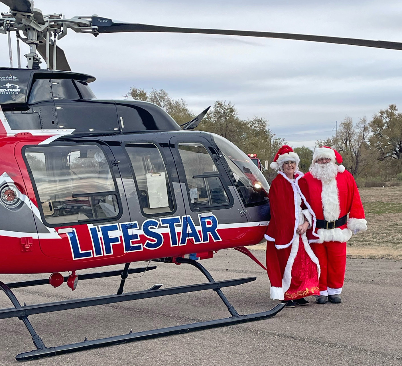 SANTA AND HIS BELOVED posed for a photo Saturday evening with the LifeStar 4 helicopter, operated out of Childress, Texas.
