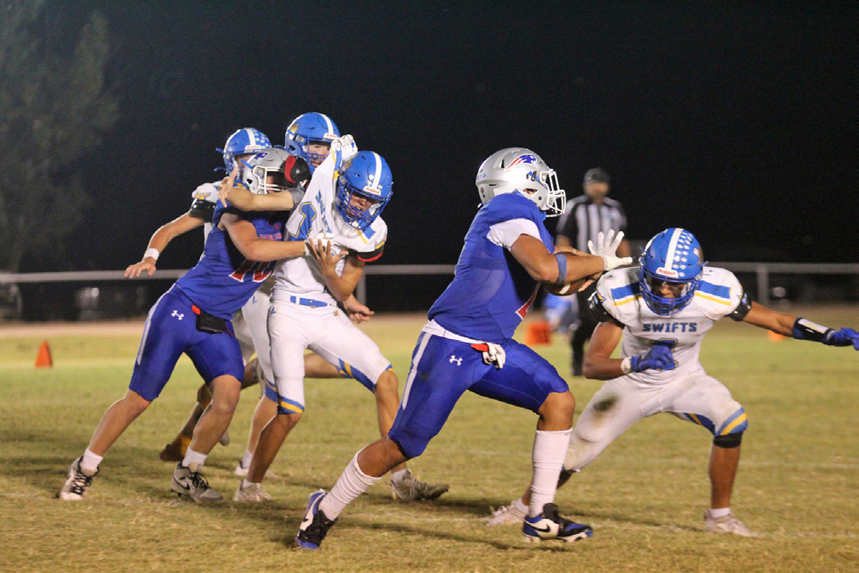 ABLOCKANDARUN Tripp Carlisle lands a solid block for Damian Valdes as he runs for a touchdown against the Nazareth Swifts. | COURTESY VALLEY YEARBOOK