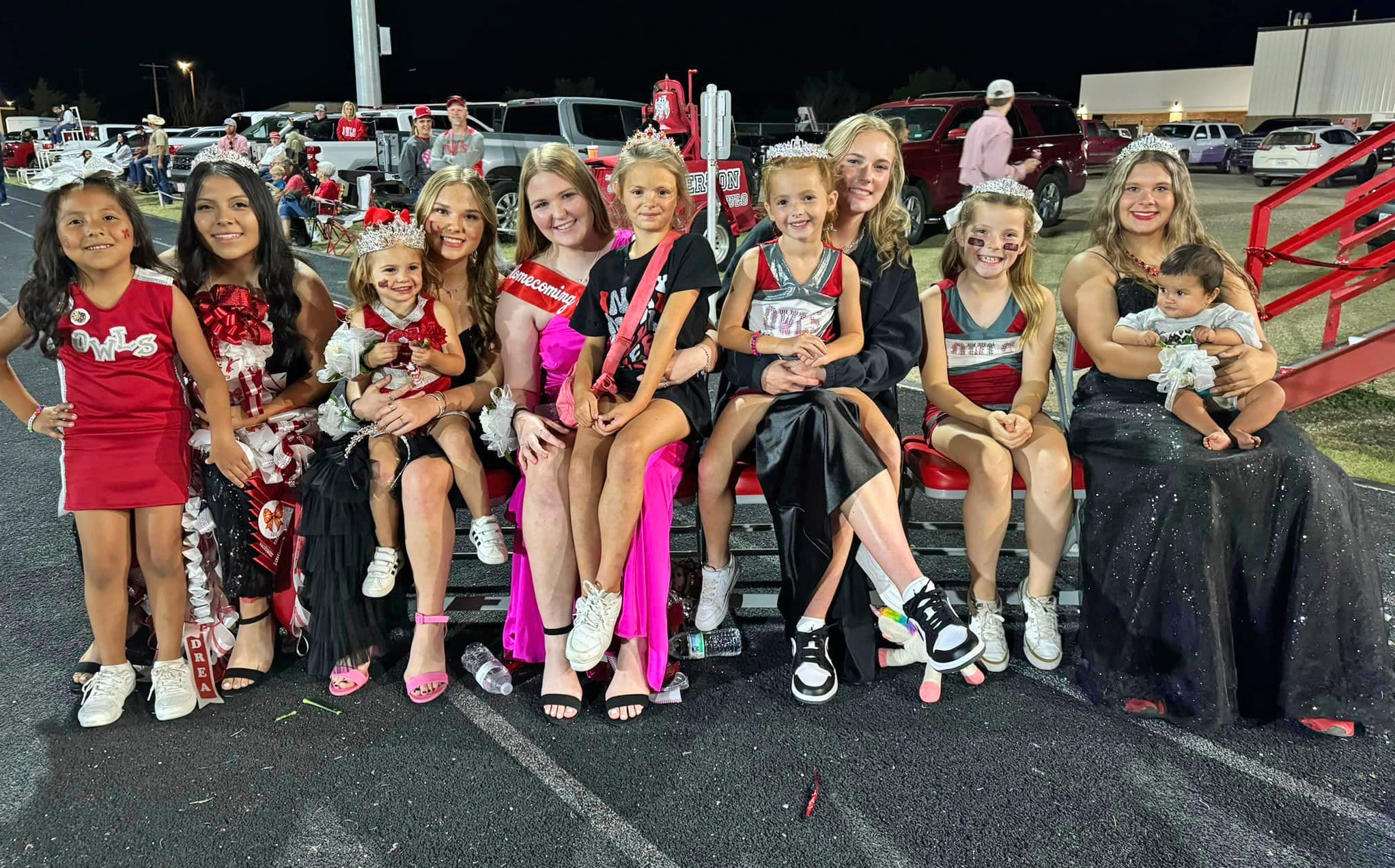 MINI OWLS soaked up attention from Homecoming Court role models before Silverton’s game last week. | HOLLY COGDELL PHOTO