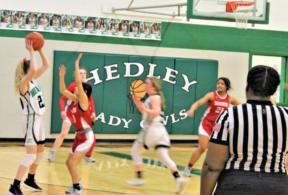 PLAYOFF BOUND The Silverton Lady Owls, shown here in last week’s victory over Hedley, have qualified for the playoffs, even though they dropped a game Friday night, losing to Claude 41–27. | COURTESY PHOTO