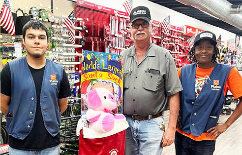 PADUCAH WINNER Congratulations go to Arty Tucker of Paducah, one of the winners of giant Santa Stockings that were given away Friday, December 22 at Plains Lumber in Paducah. | COURTESY PHOTO