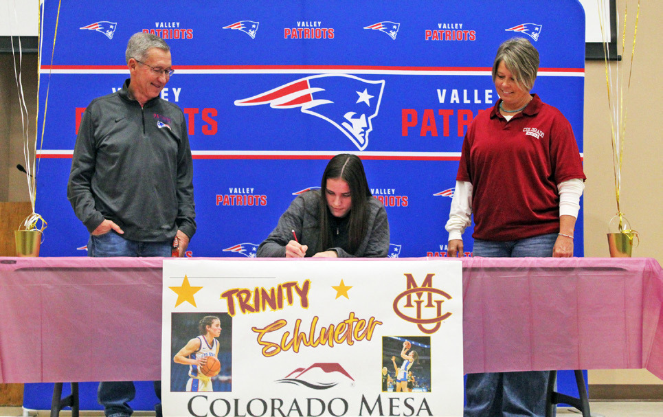 LETTER OF INTENT Valley High School’sTrinity Schlueter (middle) signed a letter of intent to play college basketball for Colorado Mesa University. | COURTESY PHOTO