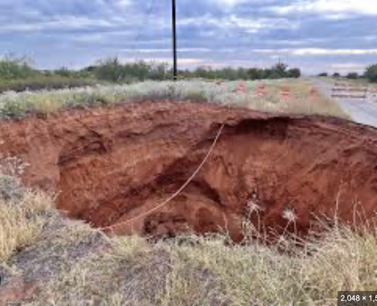 400 DUMP TRUCK LOADS of stone and dirt is what TxDOT estimates will be required to fill a 70-foot-feep sinkhole in rural Cottle County. | TxDOT FACEBOOK PAGE