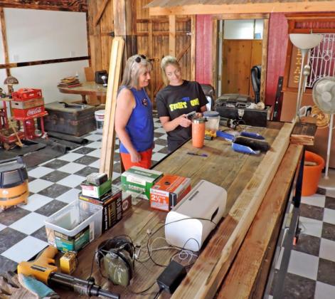 READY TO ROLL In downtown Turkey, Christy Yates and Jamie Plumlee confer at the custom-built counter of Turkey Tracks Coffee Tea &amp; Tees. The two announced Friday on Facebook that they would be open to welcome celebrants of the 50th Bob Wills Day. | HANABA MUNN WELCH; FACEBOOK