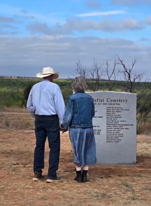 GONE, BUT NOT FORGOTTEN Matador residents and hotel owners Christian and Barbara Heim paused Saturday to read the names of those buried at the Whiteflat Cemetery whose graves have no marker. | COURTESY PHOTO