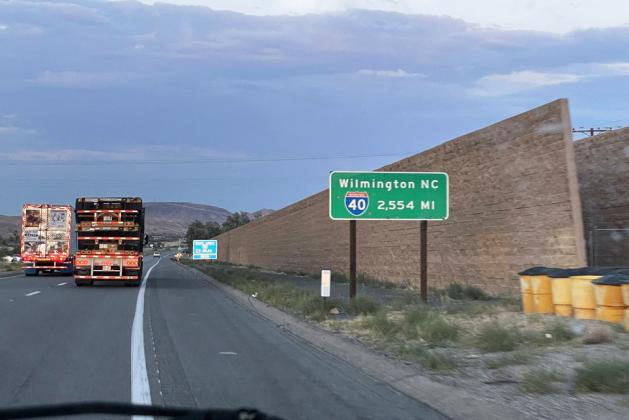 WILMINGTON, NC 2,554 MI is the flip side of a similar green Interstate sign located near the eastbound terminus of I-40. Twenty-one years ago I traveled here from Wilmington, pulled off on the shoulder here and took one of my first selfies ever, underneath this very sign.