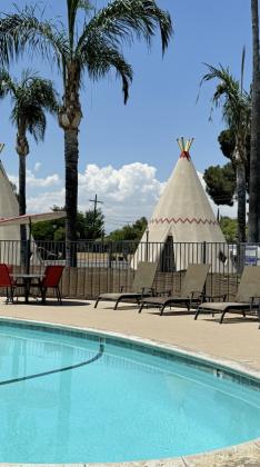 SLEEP IN A TEEPEE — it's still possible at the clean, wellrun Wigwam Motel in Rialto (San Berdardino), California, where generations of travelers have delighted in the kitschy, if inaccurately named, design.