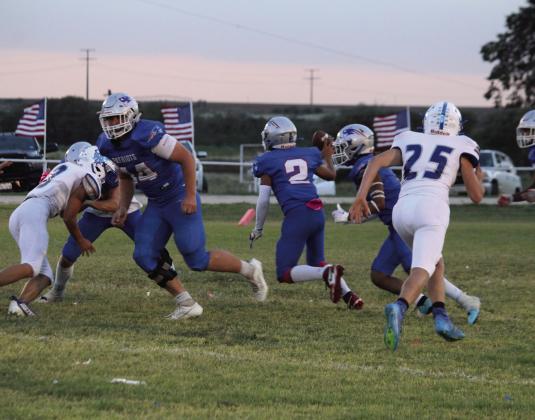 VALLEY VICTORY Freshman Damian Valdez #2 looks for a receiver while senior Tucker Schuelter #44 provides protection in Valley's 52-0 Homecoming win over White Deer. | COURTESY PHOTO