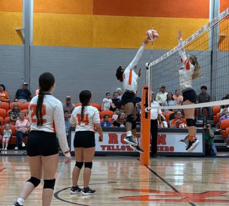 Breella Smart hits over a Rotan defender as junior setter Leticia Mejia (14) and sophomore JaylaWederski (22) look on. | SUE JANE SULLIVAN
