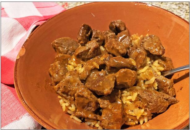 FAMILY STYLE My husband’s mother often braised cubes of beef or pork in a sauce made of freshly ground, dried chile pods. He loved it over potatoes; this version uses rice. | ANGELINA LARUE