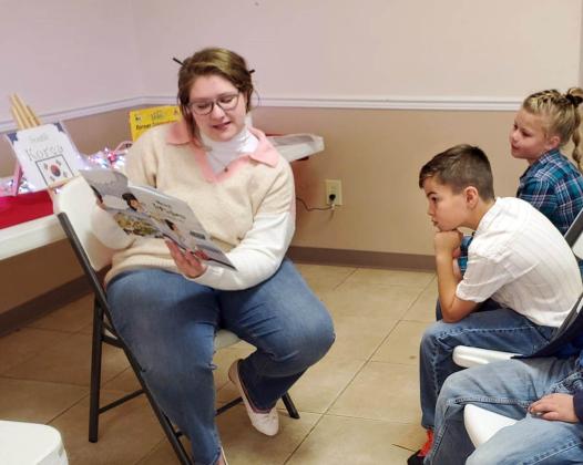 CHRISTMAS AROUND THE WORLD Volunteers at the Caprock Public Library in Quitaque last week continued a special tradition, “Christmas Around the World,” with area schoolchildren. | COURTESY PHOTOS
