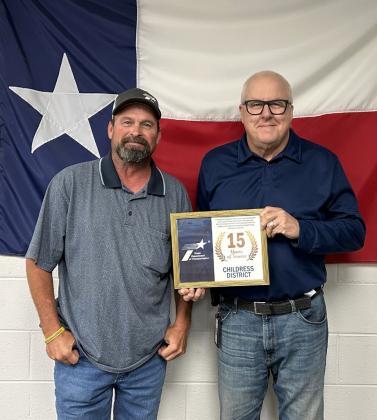 15 YEARS Cory Pointer, general transportation tech for Briscoe County, was honored with a 15-year service award. Presenting the award was District Engineer Darwin Lankford. Not pictured is Ron Gilbert, Cottle/King County maintenance supervisor, with 25 years of service. | COURTESY PHOTO