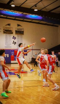 DAMIAN VALDES feeds one of six of his assists against the Borden County Coyotes at home Dec. 4. | DEY LANE