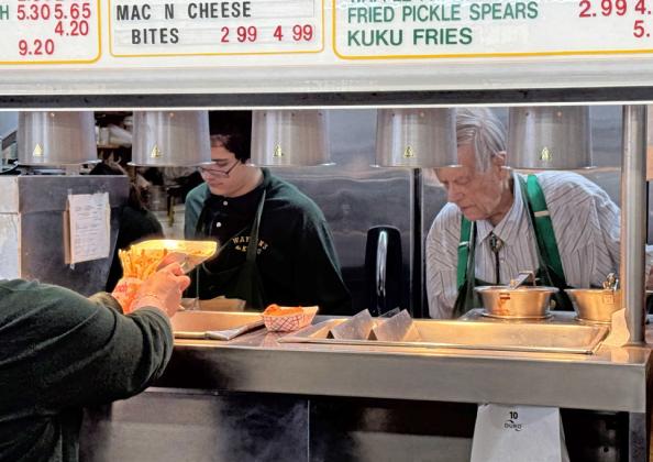 WOULD YOU LIKE SOME KUKU FRIES with that? Gene Waylan, above right, has owned and operated the last remaining restaurant in the former Ku-Ku chain for more than half a century.