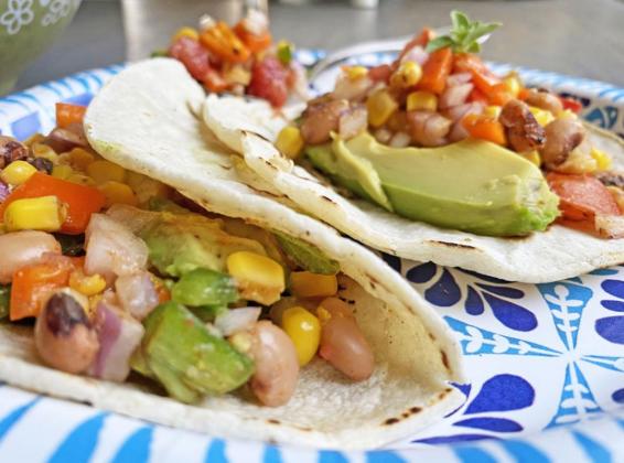 FLAVORFUL AND FLEXIBLE These jewel-toned tacos can be served meatless or with shredded chicken—and the topping goes well with rice or tortillas, too. | ANGELINA LARUE PHOTO