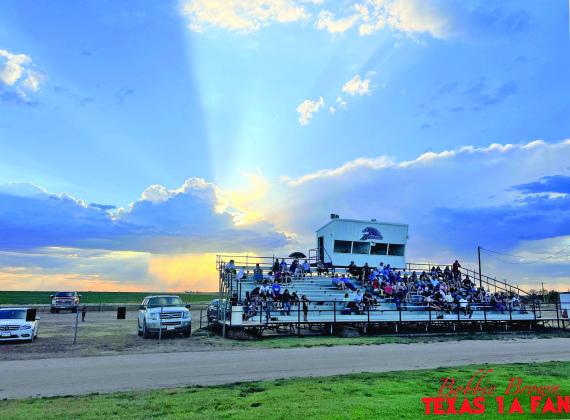 SUNSET ON SUMMER Despite the 105-degree weather, the sun is setting on summer. Last week, teachers went back to school, this week students return, and across Caprock Country football teams began scrimmaging against other opponents. Friday night the Valley Patriots were just one of the many 1A teams who traveled long, hot roads to begin the journey to another year of dreams for teams and towns. The Patriots faced the Meadow Broncos in a scrimmage. | TEXAS 1A FAN PHOTO