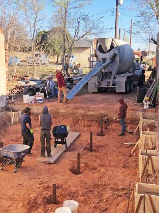 Concrete foundation poured to redevelop old storefront in Quitaque