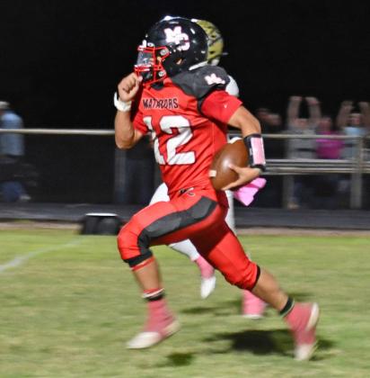MOTLEY FALLS TO JAYTON On Friday night, the Motley County Matadors hosted district rival, the Jayton Jaybirds and came up short. Jayton pulled out a win 59-50. Shown is Kadyn Roys running the ball for a touchdown and throwing for a touchdown. | COURTNEY MENDOLA PHOTOS