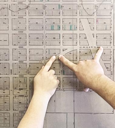 LOT SWAP proposed by Matador’s city council, to aid in plans for reclaiming the city’s scenic park, was indicated on plat maps at city hall. | CAPROCK COURIER