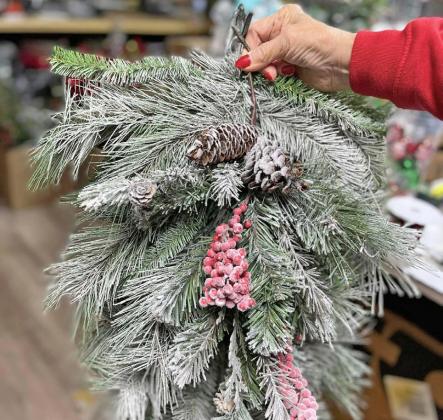 CHRISTMAS DESTINATION Along with Pigg’s baked treats and floral creations, the shop offers an array of collectibles and gifts, elegantly displayed. | COURTESY PHOTO