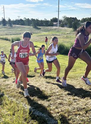 ROAD TO SUCCESS RUNS UPHILL Briggs Holt, Haygen Lopez and Melody Rampley know this uphill run all too well after competing in the Lubbock Christian University invitational high school cross country meet on Saturday, Sept. 13. The Silverton high school and junior high XC teams also ran in Clarendon on Wednesday, Sept. 16 and the high school team is slated to run in Lubbock on September 27. | COURTESY PHOTOS