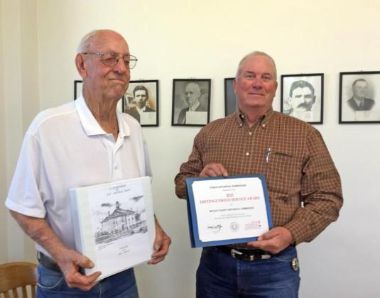 MOTLEY HONOR Ronald Bailey is recognized by Judge Jim Meador for contributing with research on historic Matador businesses, helping the Motley County Historical Commission earn the 2021 Distinguished Service Award from the Texas Historical Commission. | COURTESY PHOTO