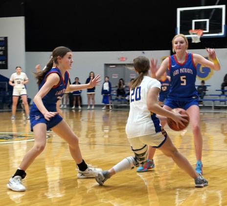 DOUBLE-TEAM Valley’s Cruse Paisley (left) and Allie Pigg (5) trap a Spur player in the Lady Patriots’ district win January 17. | SUE JANE SULLIVAN