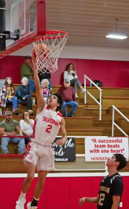 HAYGEN LOPEZ LAYS UP 2 for the Owls Friday night against the Tigers.