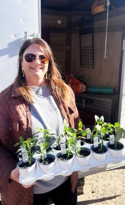 GREEN THUMBS Chelle’s Garden co-owner Rachelle Watson looks forward to helping local gardeners and homeowners bring some green into their landscapes. Husband Brady is collaborator in the enterprise. | COURTESY PHOTO